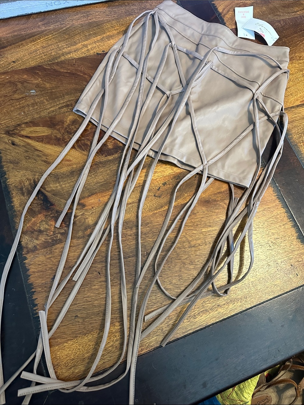 Hot & Delicious mini skirt with long tassels. NWTs size S Taupe color.